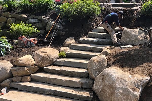 Cole Landscaping hardscape step and wall construction on a North Shore Massachusetts property
