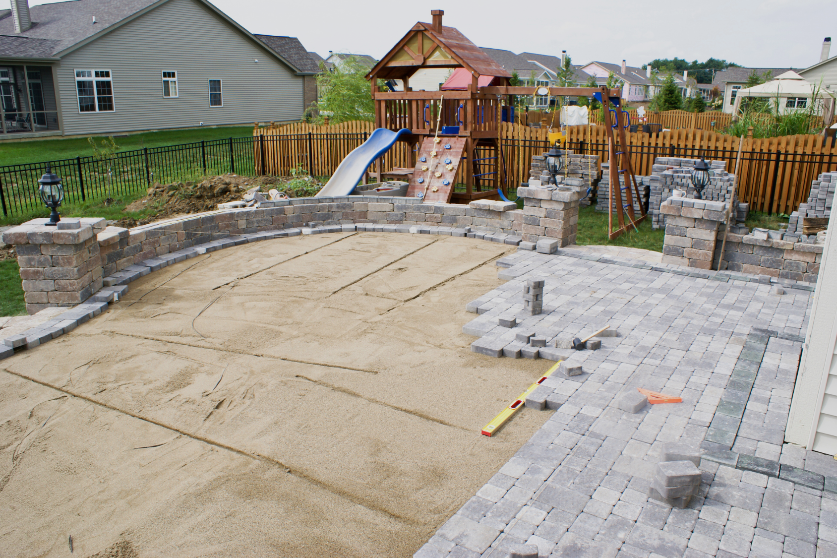 Freshly reset and re-leveled paver patio on a North Shore Massachusetts property by Cole Landscaping