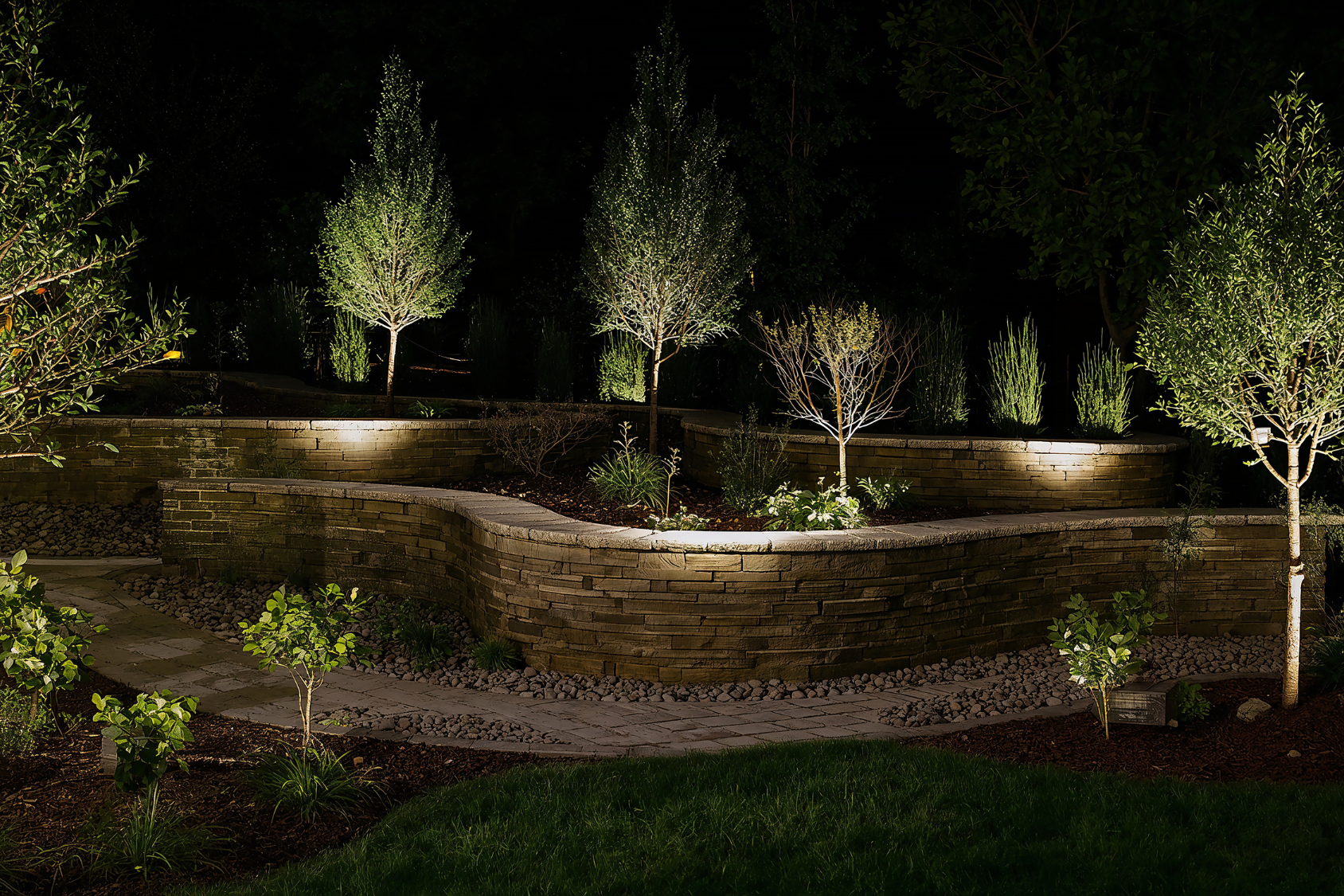 Natural stone tiered retaining wall and garden on a North Shore Massachusetts property by Cole Landscaping